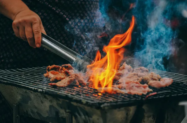 Private chef grilling over open flames